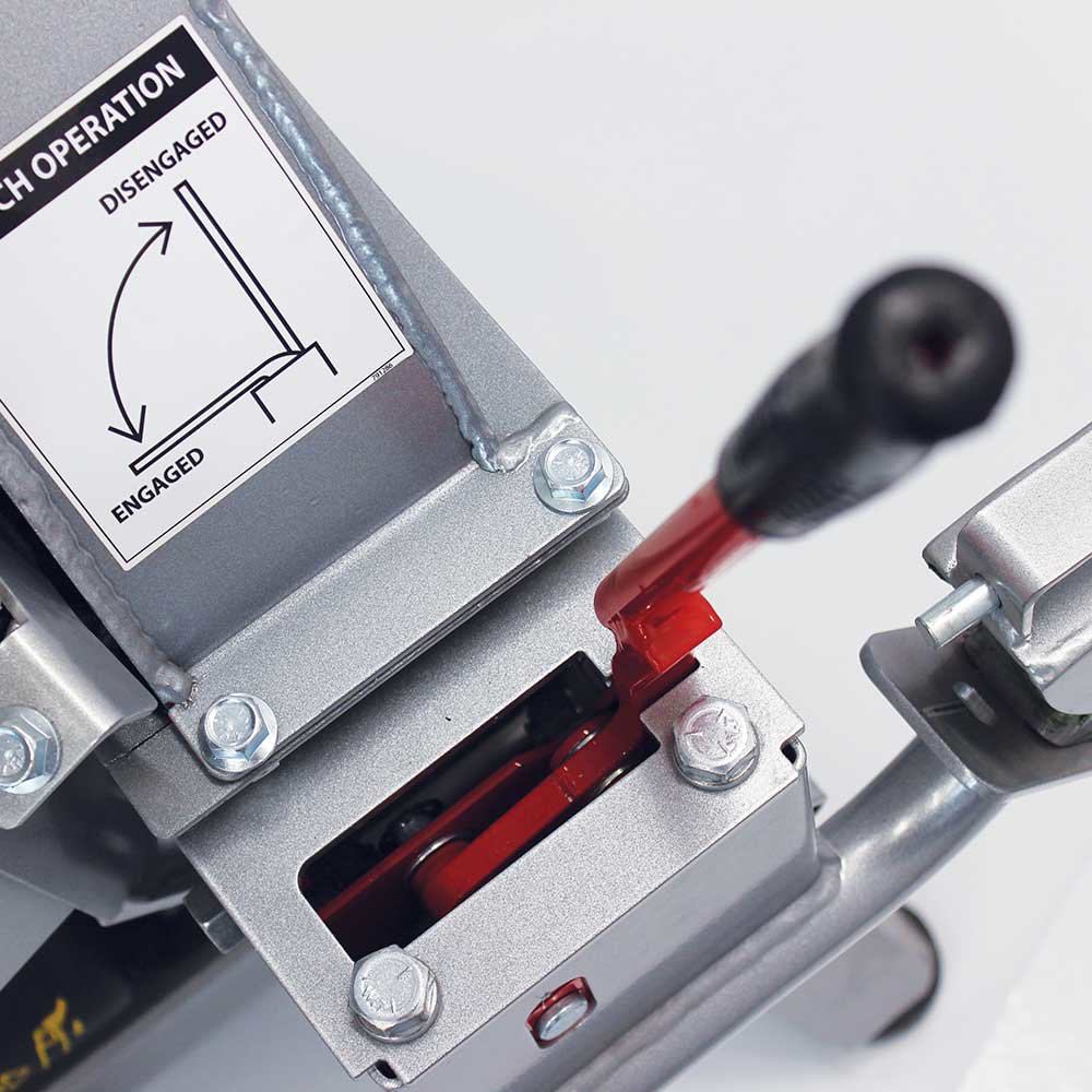 A close-up on the engagement lever of the Dosko 13-21T-13H brush chipper, with a diagram showing the "ENGAGED" and "DISENGAGED" positions.