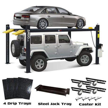 A silver sedan is parked on the upper platform of a black AMGO 408-HP-DX 4-Post Parking Lift, with a white SUV stored underneath. The included drip trays, steel jack tray, and caster kit are shown in the foreground.