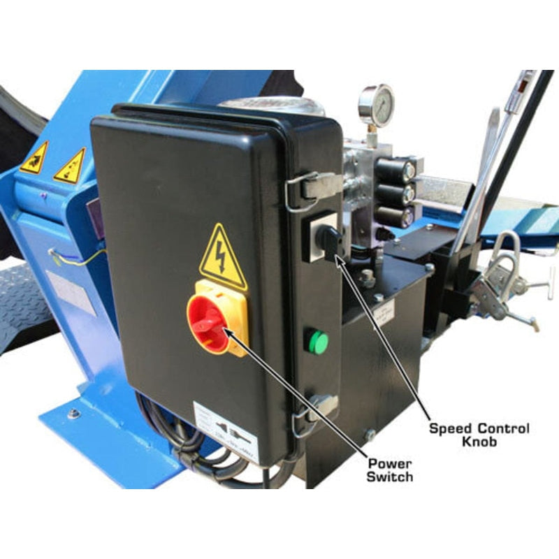 A close-up of the power control box on the Atlas TTC303 Truck Tire Changer, showing the speed control knob and power switch. The machine operates on 220V, 1-phase electric power.