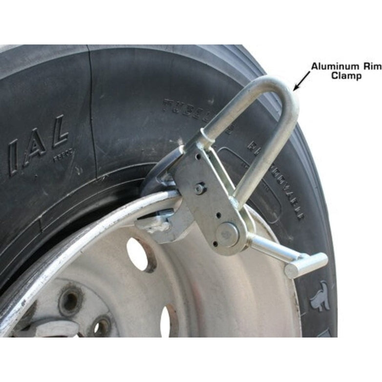 A close-up of the aluminum rim clamp from the Atlas TTC306 Truck Tire Changer, shown clamped onto a tire rim.