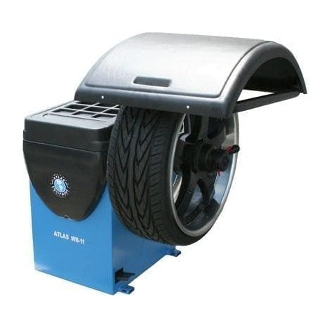 A blue Atlas WB11 computerized wheel balancer, with a tire mounted and a safety hood down, ready for balancing.