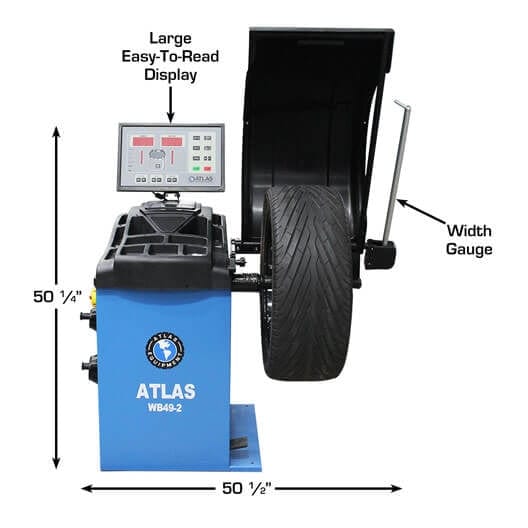 A side view of the blue Atlas WB49-2-PRO Wheel Balancer, with a tire mounted and a view of its ergonomic design, including the foot pedal brake at the base.