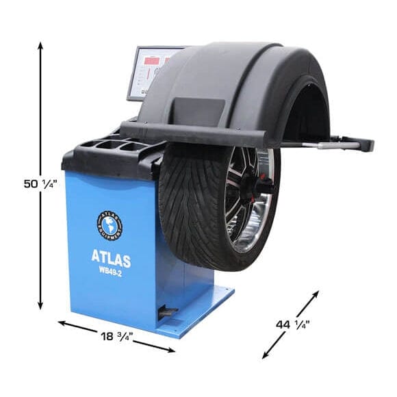 A full view of the blue Atlas WB49-2-PRO Wheel Balancer, with a mounted tire, and the dimensions of 50" high, 46 1/4" wide, and 64 1/2" with the hood open.