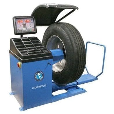 A front view of the Atlas WBT-210 Truck Tire Wheel Balancer with a mounted truck tire.