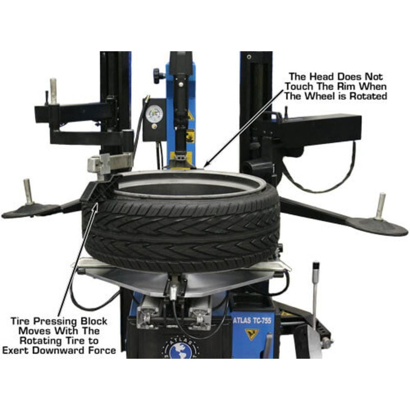 A tire mounted on the Atlas TC755DAA Tilt-Back Tire Changer. The image notes that the head does not touch the rim when the wheel is rotated and that the tire pressing block moves with the tire.