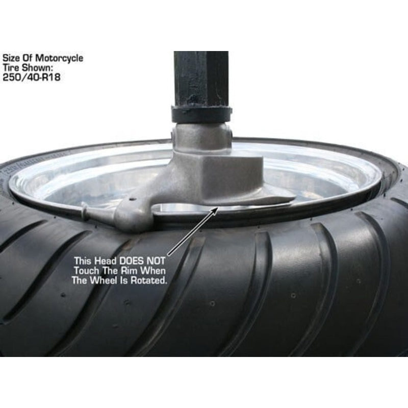 A close-up of a mounted tire and rim on the Atlas TC755DAA, showing the bead roller in place and noting that this head does not touch the rim when the wheel is rotated. The tire size is labeled as 250/40 R18.