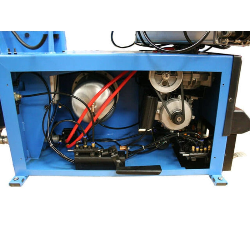 A view of the internal components and motor on the Atlas TC755EZ tire changer.