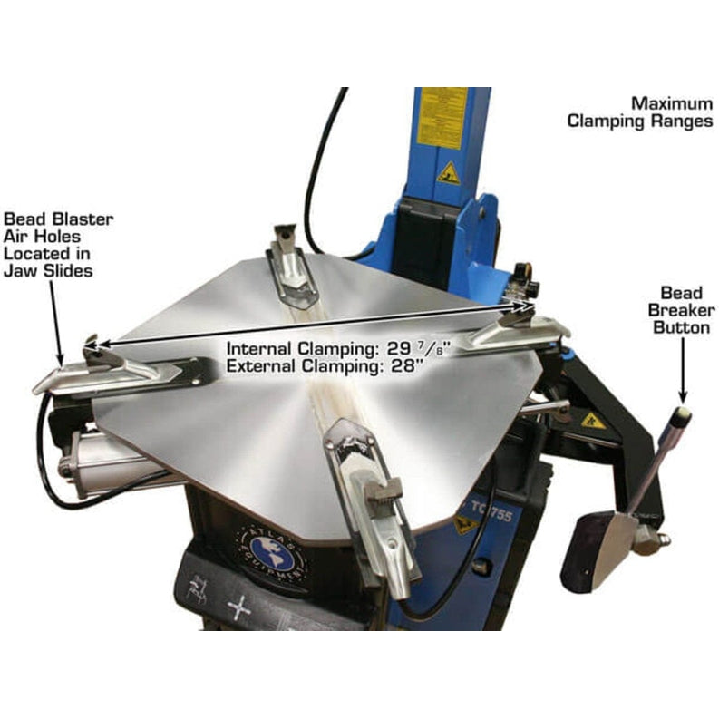 A close-up view of the turntable on the Atlas TC755DAA Tire Changer, showing the maximum clamping ranges, Bead Blaster Air holes, and Bead Breaker Button.