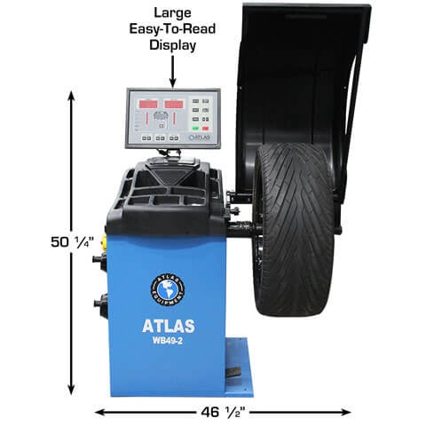 An Atlas WB49-2 Wheel Balancer with a tire mounted. The image labels the unit's large easy-to-read display and its 50 1/4" height and 46 1/2" width.
