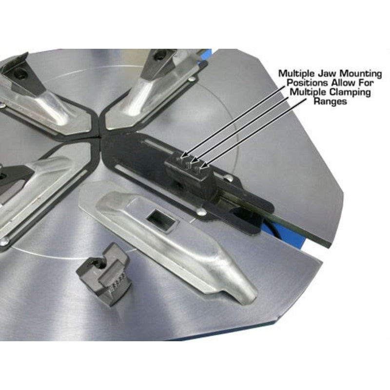 Overhead view of the Atlas TC289 tire changer's turntable, showcasing multiple jaw mounting positions that allow for multiple clamping ranges.