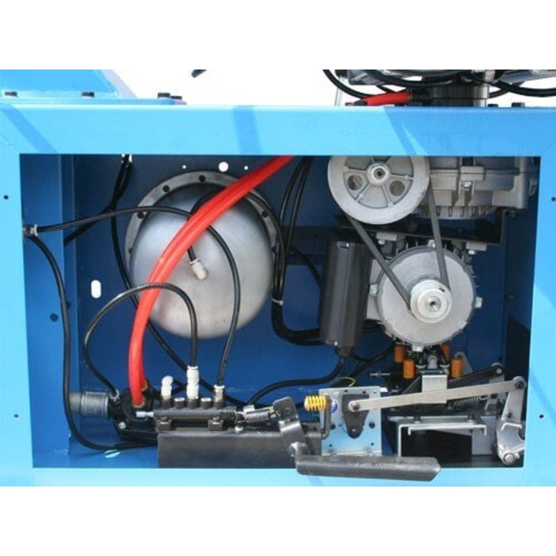 An interior view of the Atlas TC289DAA tire changer, showing the internal motor, air cylinder, and precision linkage.