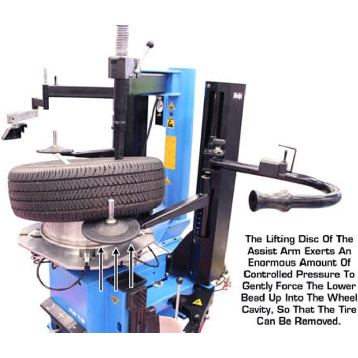 The blue Atlas TC289DAA tire changer with the assist arm's lifting disc exerting pressure to gently lift a tire bead off the rim for removal.