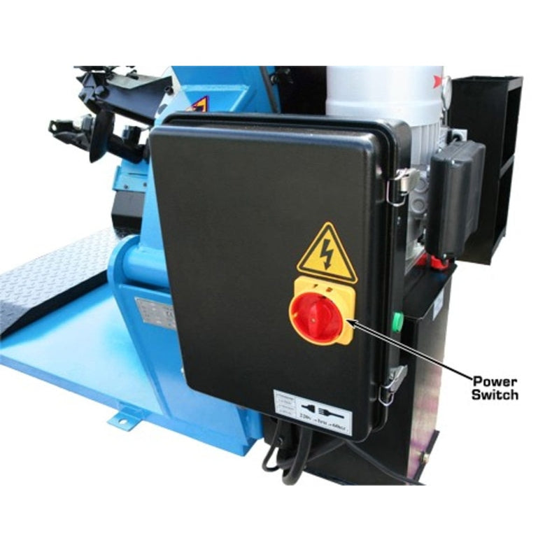 A close-up of the Atlas TTC301 Truck Tire Changer's main power switch with a prominent red emergency stop button.