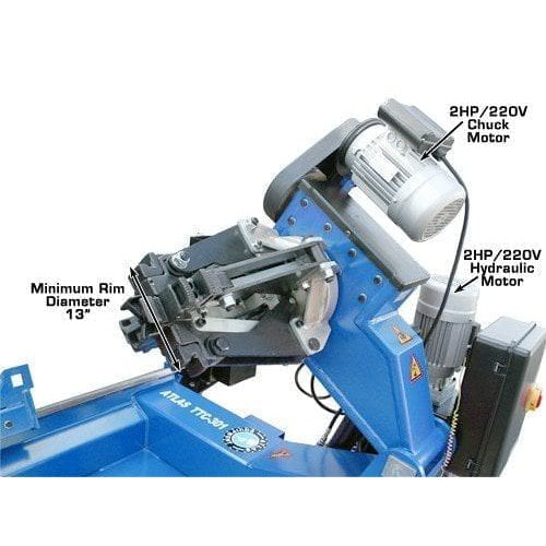 A close-up of the Atlas TTC301 Truck Tire Changer's 3 HP 220V chuck motor and 2 HP 220V hydraulic motor.
