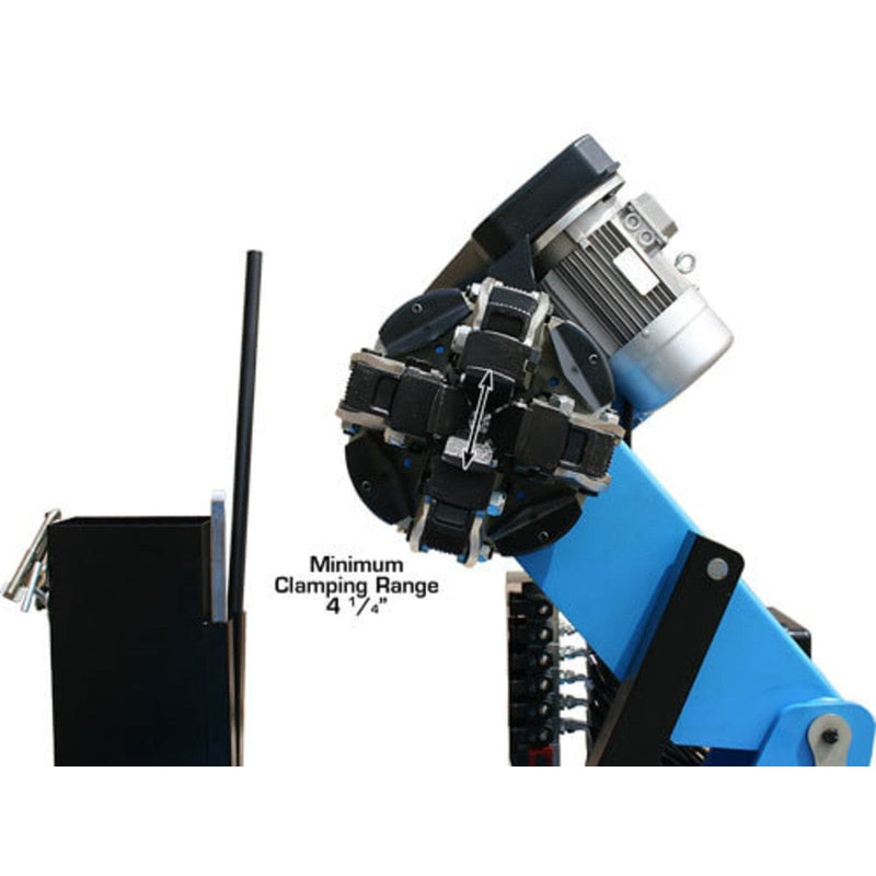 A close-up view of the powerful, hydraulically controlled jaws of the Atlas TTC606 commercial truck tire changer, showing a minimum clamping range of 14 inches.