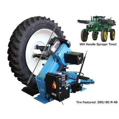 A large, heavy-duty blue and black Atlas TTC606 commercial truck tire changer, with a 380/90 R 46 tire mounted on its hydraulic arms, along with a small image of a green tractor sprayer in the background.