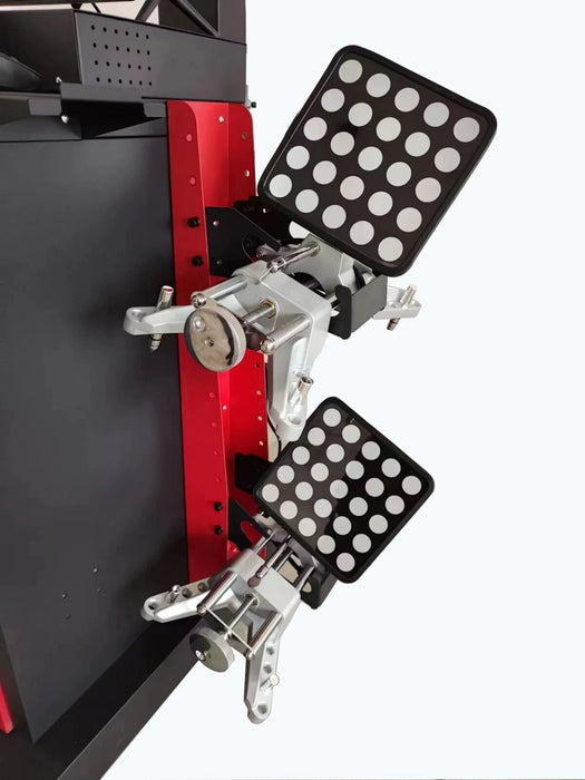 A close-up of the black wheel targets for the Katool KT-AV6 3D Wheel Aligner. The image shows two targets with reflective dots, attached to a silver metal clamp, which is mounted on a red lift arm in the background, demonstrating how the targets are used during the alignment process.