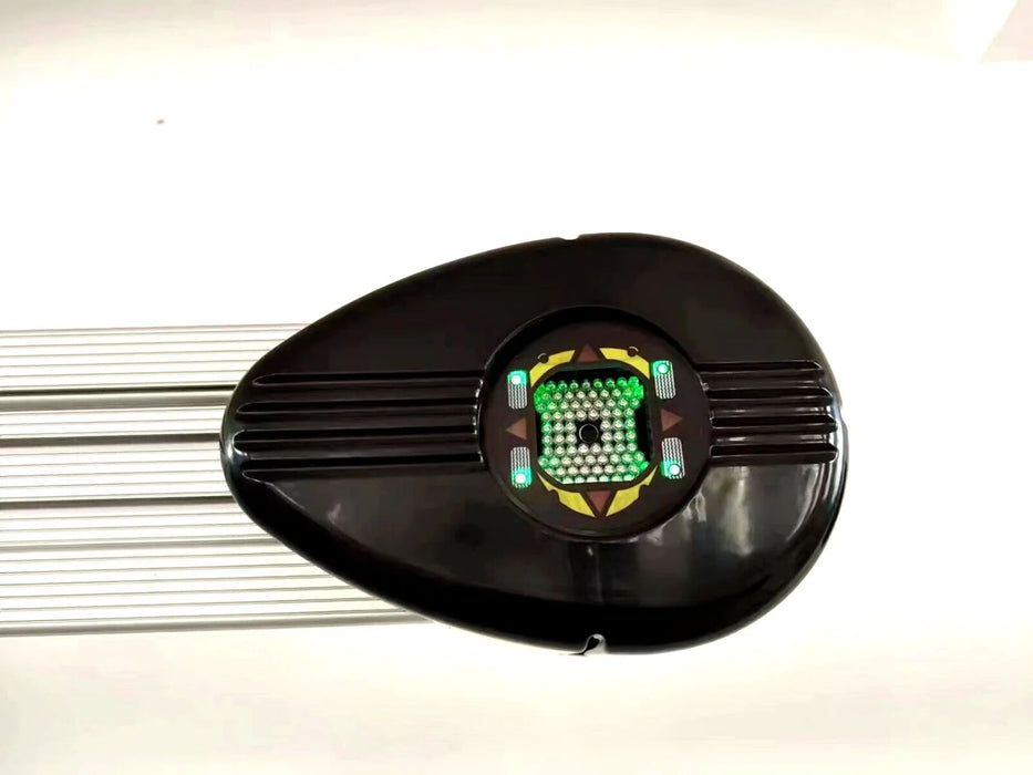 A close-up of one of the black wheel targets for the Katool KT-AV6 3D Wheel Aligner. The image provides a detailed view of the reflective dots and the integrated green lights, which are used by the camera system to read alignment angles.