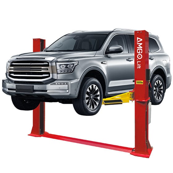 An AMGO BP-10 2-Post Base Plate Lift, a red lift with yellow arms and a base plate, elevating a silver SUV against a white background.