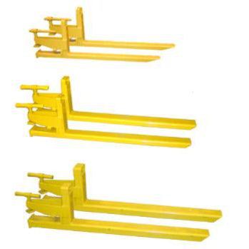 A product shot of three different sized yellow clamp-on bucket forks with their different tine lengths lined up in a row.