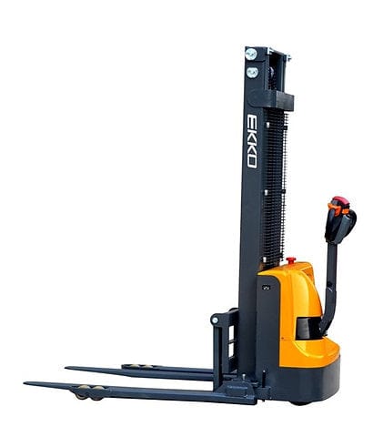 An angled front view of the EKKO EB12E-138 electric straddle stacker, highlighting the side profile of its frame and mast as well as the ergonomic control handle.