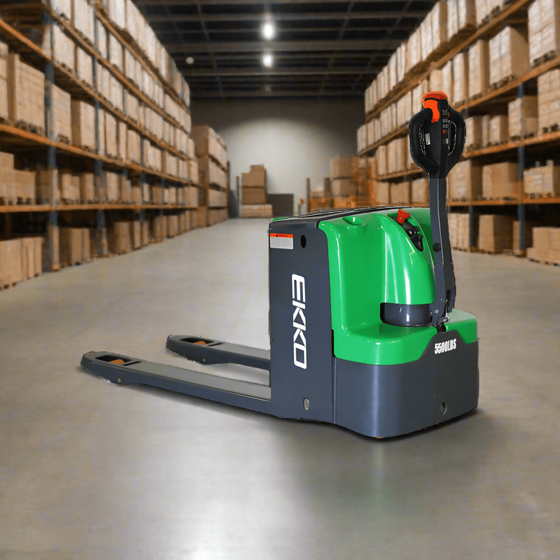 An EKKO EP25E-Li Electric Walkie Pallet Jack with a 5500 lbs load capacity is positioned in the center of a warehouse aisle, with aisles of shelves and boxes in the background.