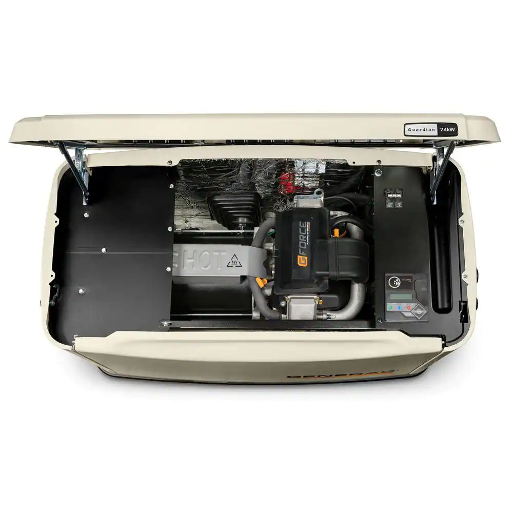 A top view of an open Generac Guardian Series 26kW Home Standby Generator, revealing the internal engine, wiring, and a black base. A "HOT" warning is visible.