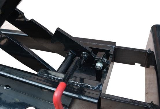 A detailed view of the black and red components of the AMGO J5H Jacking Beam, showing the heavy-duty metal structure and a hydraulic hose.