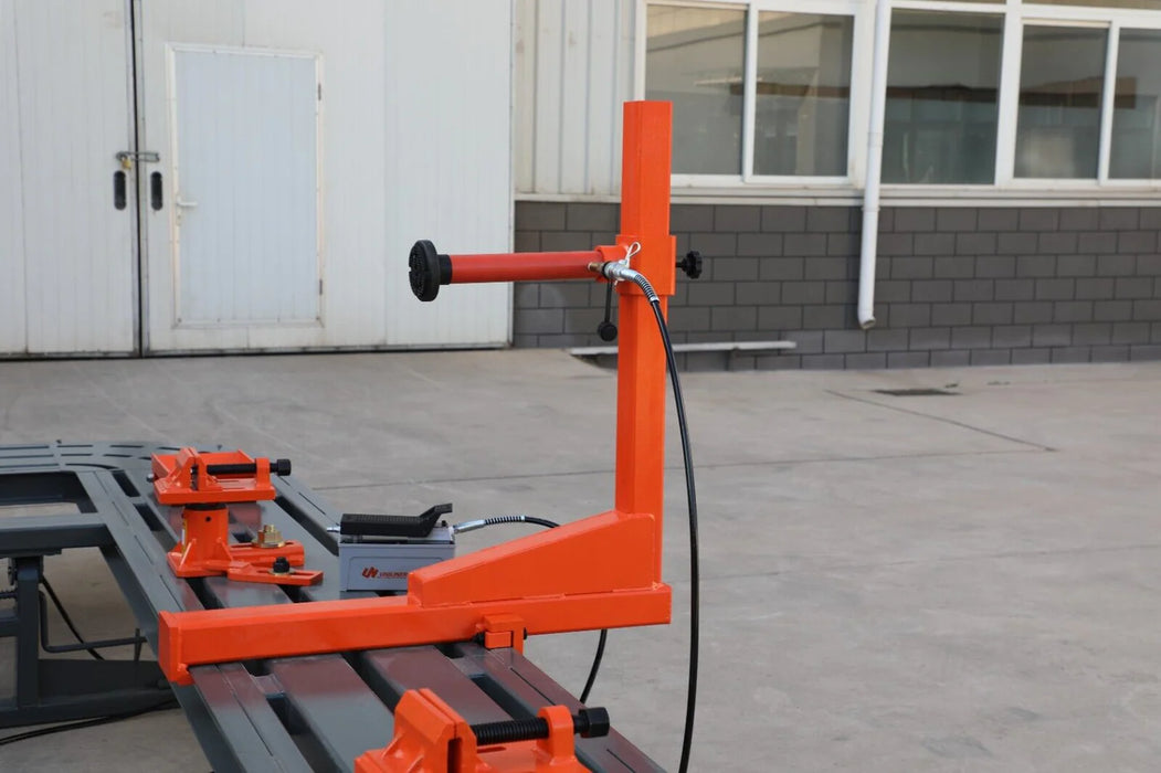 The orange pulling tower of the Katool KT-198L frame machine, showcasing its multi-directional arm and pneumatic components. The image highlights the innovative tower wheel design for precise adjustments.