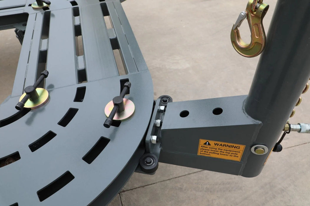 A close-up of the Katool KT-198L frame, showing the tower's base connected to the track. A yellow warning sticker is visible, along with the durable metal construction of the tower and the frame's grid pattern.