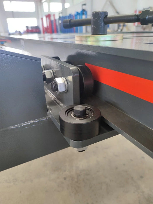 A close-up of a main frame support on the Katool KT-299U, showing the durable roller wheel and its connection to the side of the frame. This highlights the machine's 360-degree maneuverability.