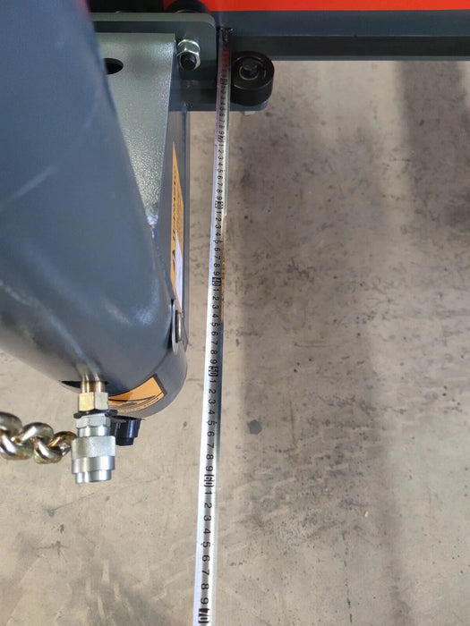 A close-up of the Katool KT-299U's roller mechanism and a section of the frame, with a visible chain and measurement markings. This view highlights the high-quality construction and the machine's precision.