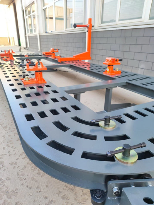 A close-up of the Katool KT-299U Frame Machine, focusing on the main clamps and the intricate grid pattern of the frame. The image highlights the precise positioning slots on the black frame.