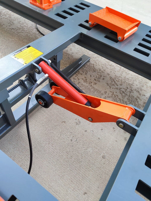 A close-up of the hydraulic lifting mechanism on the Katool KT-299U Frame Machine, showing its orange and black metal components. The image highlights the machine's ability to tilt the platform for various repairs.