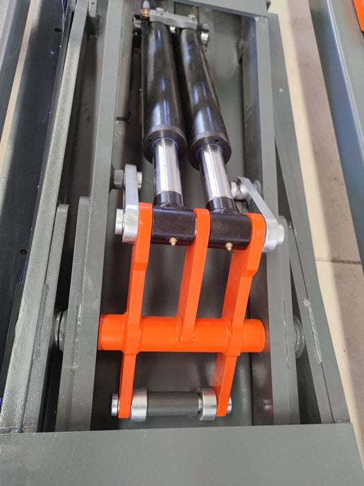 A close-up shot of the dual hydraulic cylinders on the Katool KT-310 frame machine, highlighting the robust construction of the lifting mechanism.