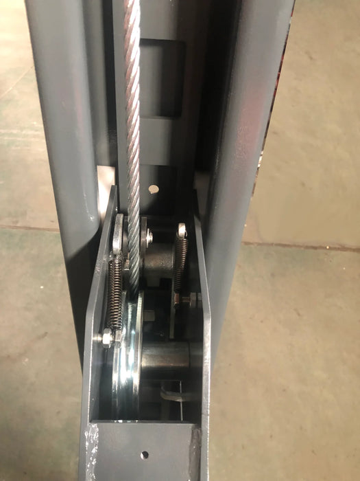 A close-up view of the internal steel cable and pulley system on one of the Katool 4-post car lift's posts