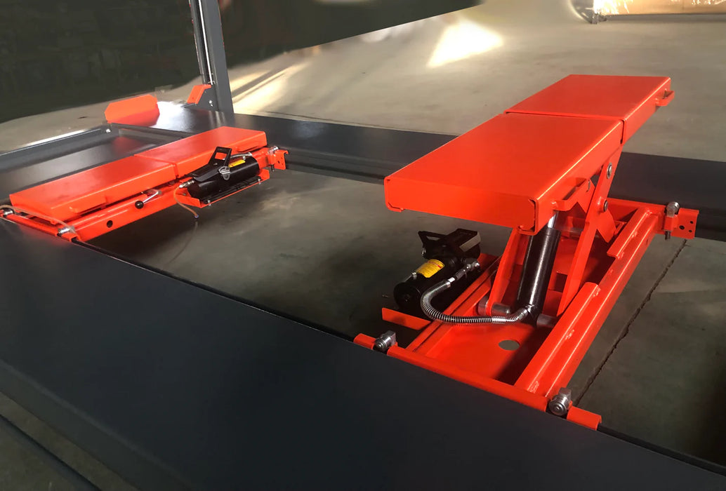 A close-up view of two bright orange rolling jacks resting on the gray runways of the Katool KT-4H110 4-post vehicle lift, ready to be used for wheel-free vehicle maintenance