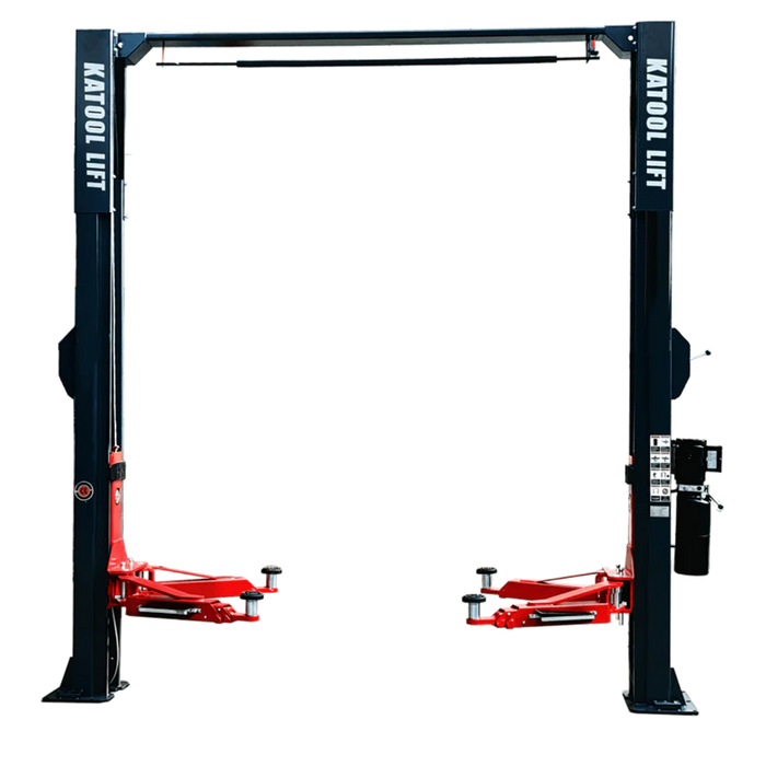 A detailed, full-body shot of the Katool Model: AS110D 2-post car lift on a blank background, featuring its black posts and red lifting arms. The image also shows a tire balancer attached to the side, highlighting the machine's multi-purpose functionality
