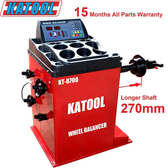 Red Katool Wheel Balancer B700 with control panel, warranty and shaft labels, Katool branding on side, metal body.