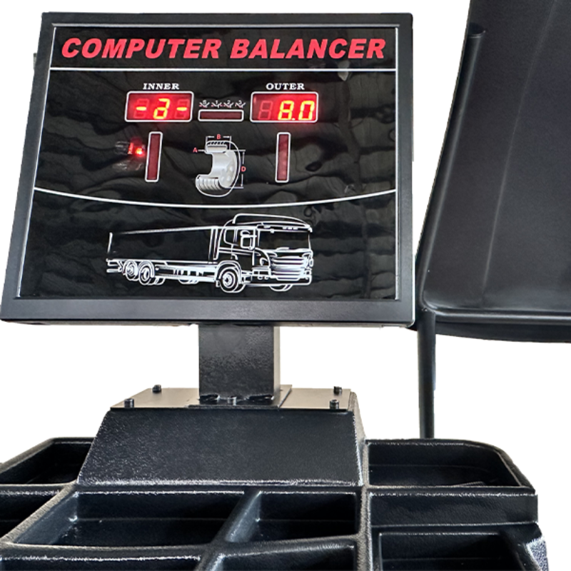 A close-up of the digital control panel on the Katool KT-B795L Heavy Duty Truck Wheel Balancer, showing a digital readout of "Inner" and "Outer" wheel balance values and a graphical display of a truck, indicating its heavy-duty purpose.