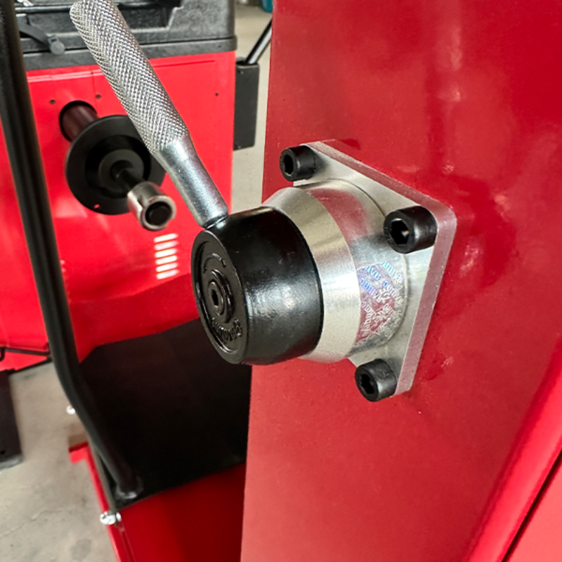 A close-up view of the quick-release lock nut on the Katool KT-B795L Heavy Duty Truck Wheel Balancer, designed for fast and secure mounting of wheels onto the machine's shaft.