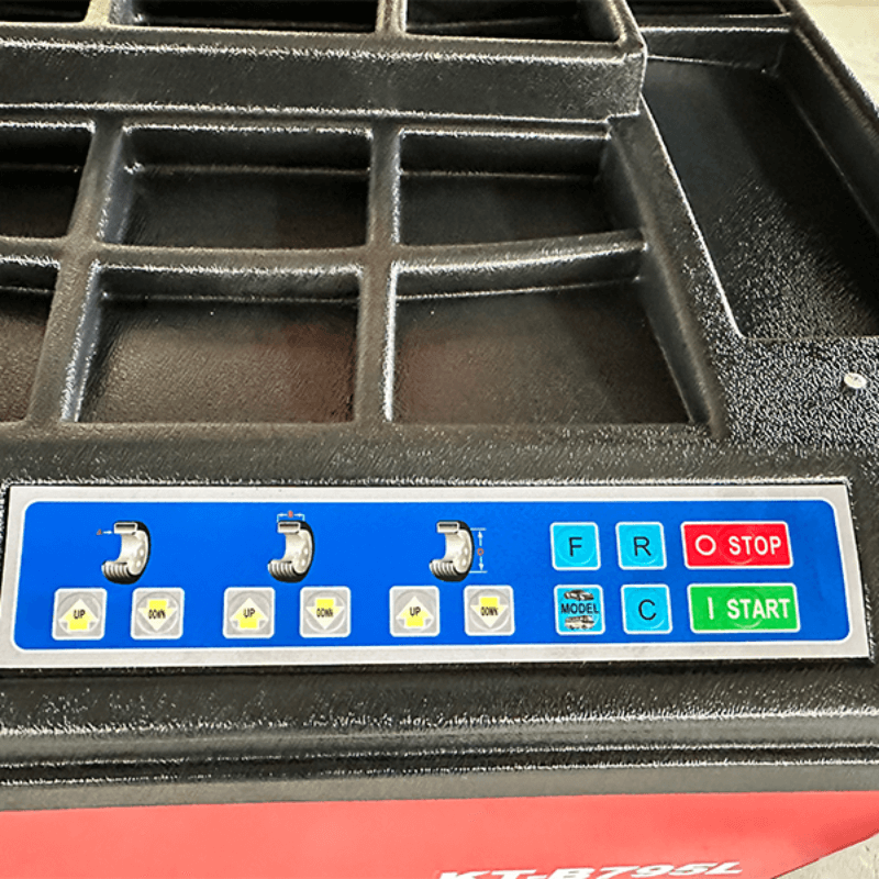 A detailed shot of the control panel on the Katool KT-B795L Heavy Duty Truck Wheel Balancer, which features a clear layout of function buttons and status indicator lights for seamless wheel balancing operations.