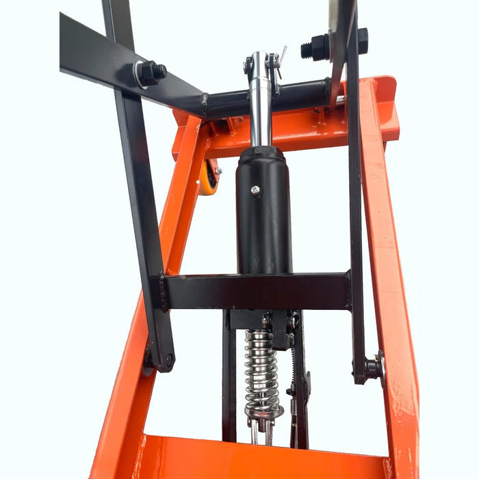 A close-up of the Katool Scissor Lift Table's black hydraulic piston and orange scissor mechanism. The spring is visible, which ensures smooth and powerful lifting performance for up to 330 lbs.