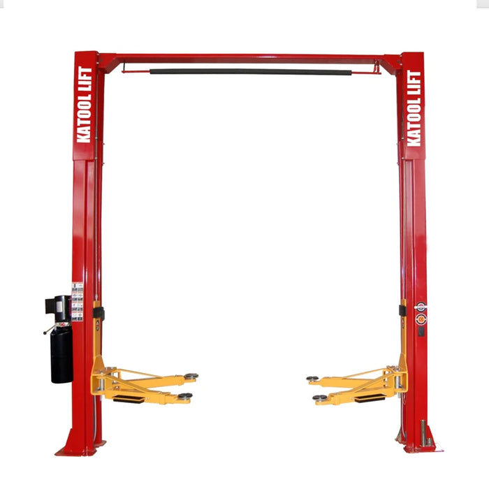 A red and yellow Katool KT-M110 2-post car lift with a clear floor design, symmetric arms, and dual columns.