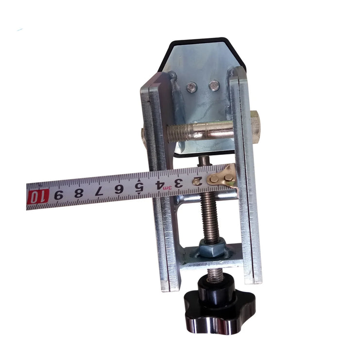 A technical shot of a single clamp from the Katool Motorcycle Adaptor for Wheel Clamp Tire Changer MC1 kit, with a measuring tape positioned to show its exact dimensions and clamping range. This visual highlights the precision engineering and confirms the accessory's compatibility with a broad spectrum of motorcycle wheel sizes.