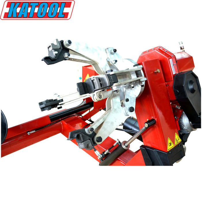 A detailed view of the bead breaker arm and lever on the Katool Four-Post Vehicle Lift Tire Changer Machine 11,000lbs KT-T160, a key component for efficiently breaking the bead on heavy-duty truck and bus tires.