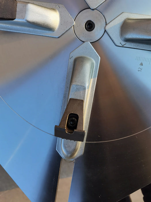 A detailed, close-up view of one of the four alloy steel clamping jaws on the turntable of the Katool KT-T835 tire changer. The jaw is shown with a protective black cover, which helps prevent rim damage.