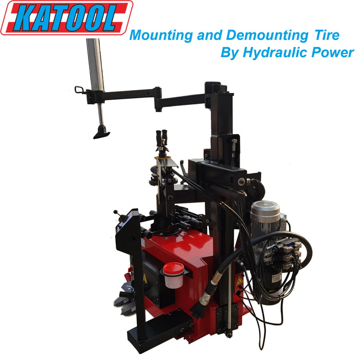 A full view of the red and black Katool KT-T900 tire changer. This hydraulic-powered machine is designed for mounting and demounting tires. The image highlights its robust structure, control panel, and hydraulic arm.