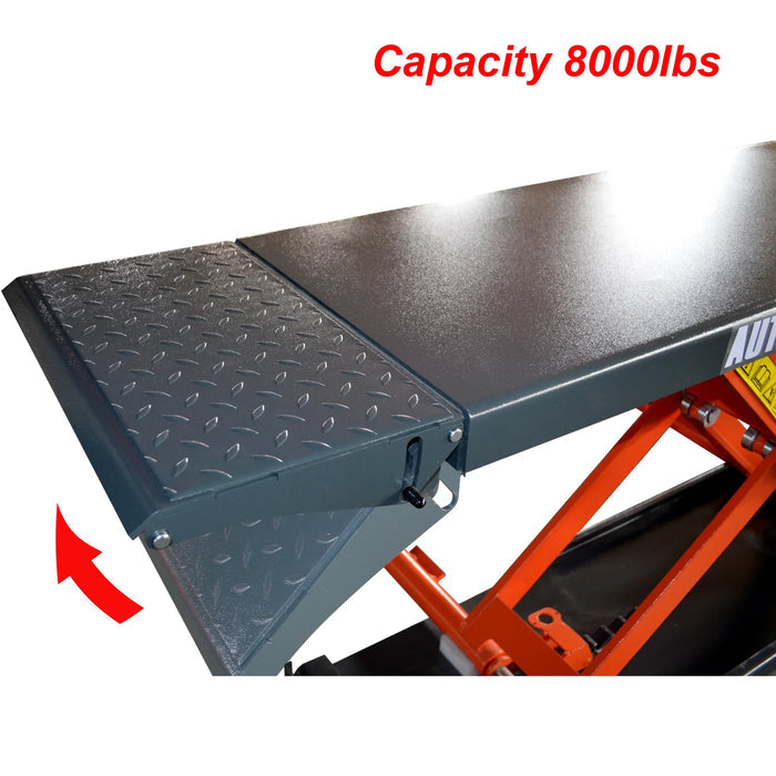 A close-up side view of the KT-X80-ELECTRIC scissor lift platform, highlighting the black anti-slip surface with a diamond pattern and the foldable drive-up ramp. "Capacity 8000lbs" is in red text at the top.