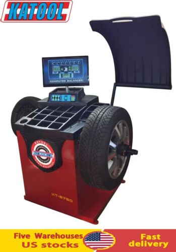 A high-end Katool Computer Wheel Balancer Machine KT-B750 in a sleek, two-tone red and black design. This machine is featured with its protective hood raised, revealing the main spindle and a tire mounted for balancing, ready to begin service.